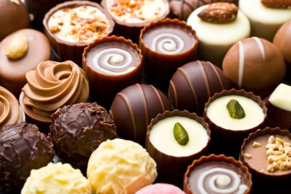 Chocolate with fillings such as truffles and caramel, including ingredients like sugar and cream